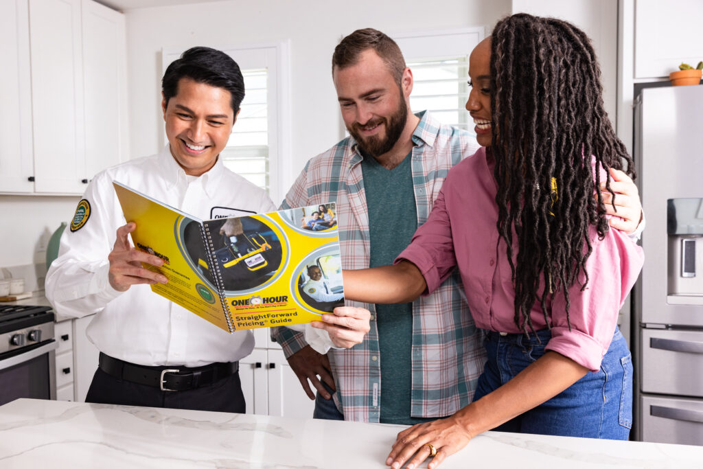 A technician showing customers options